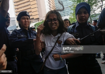 KUALA LUMPUR, MALAYSIA - 2015/08/01: A protester was detained by Malaysian police during the 